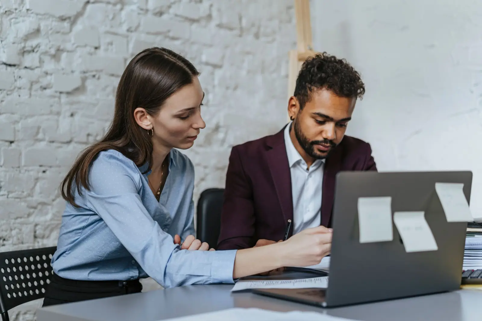 Technical colleagues collaborating on a consulting project