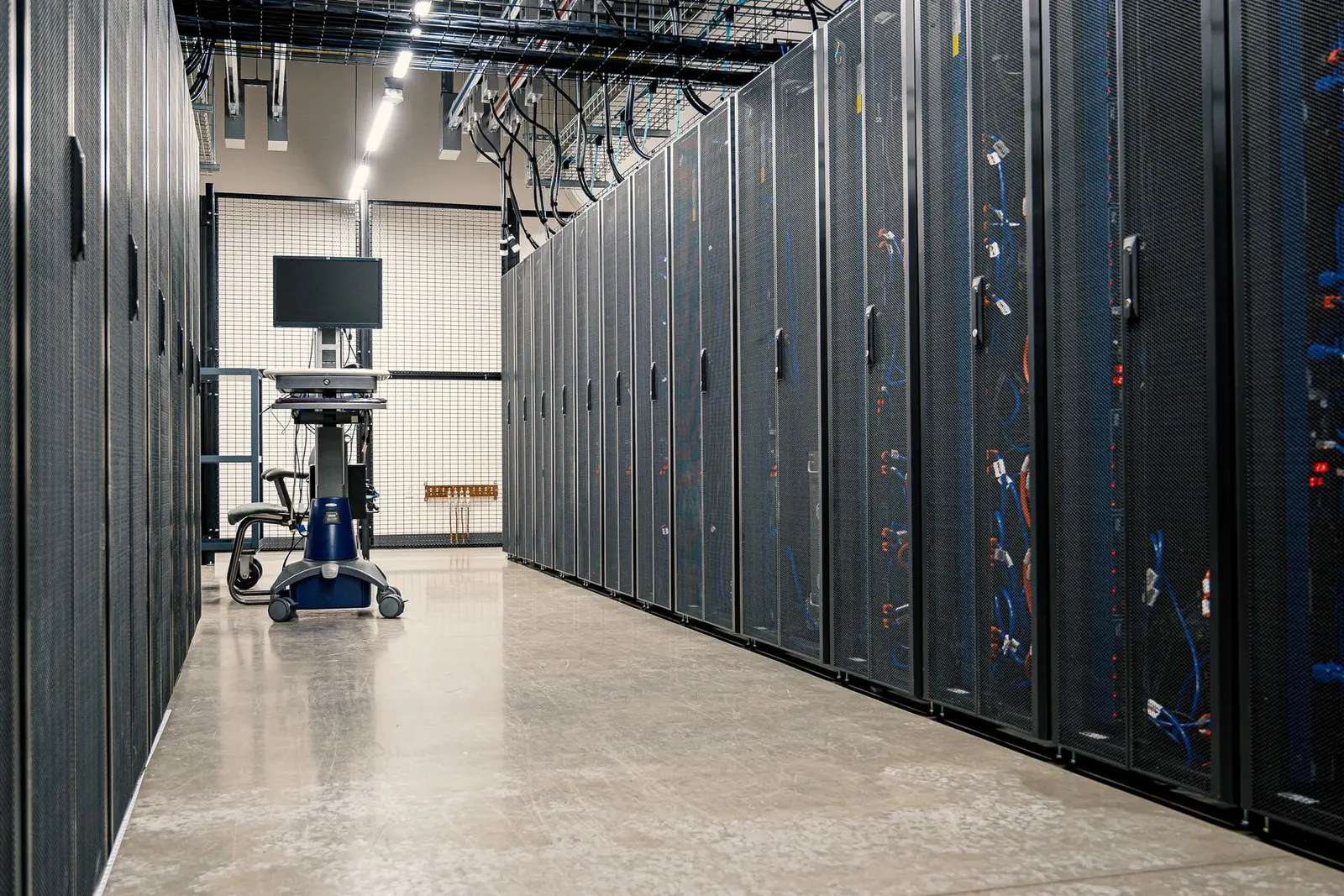 Modern datacenter aisle with clean rows of enterprise server racks